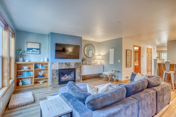 Unwind in your spacious living room with a cozy fireplace, perfect for relaxing evenings after exploring the area.