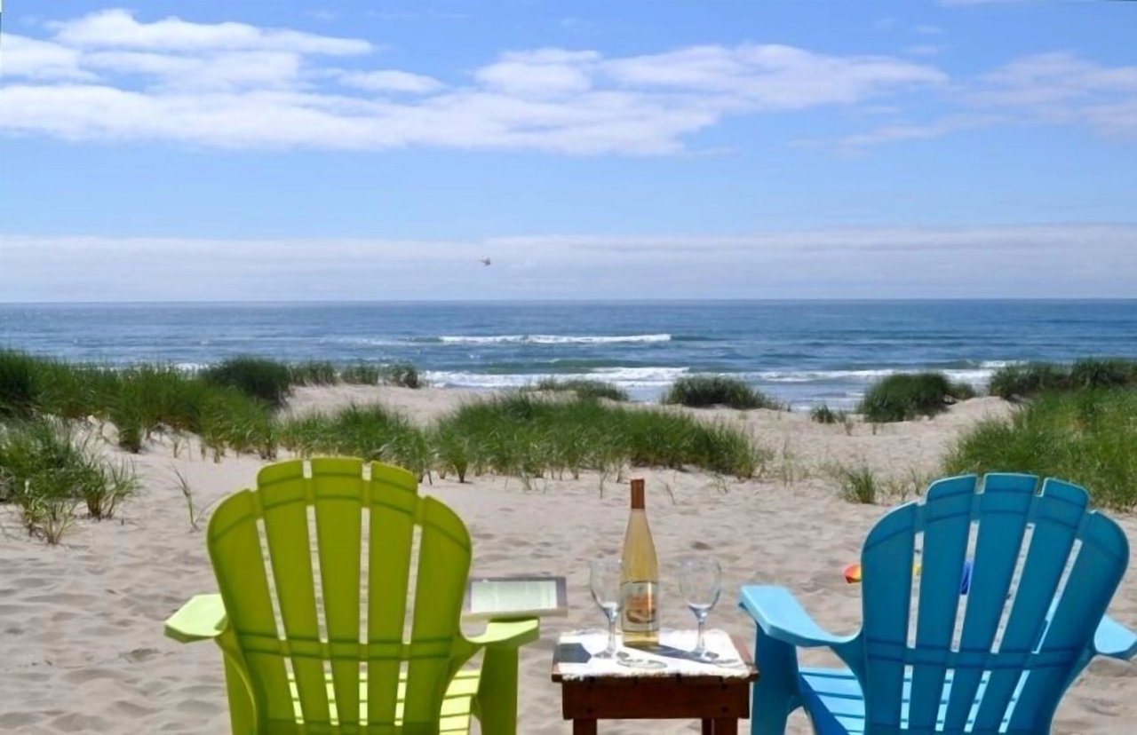 Unwind with your favorite drink as you take in the serene beachfront setting. Soft sand, ocean breezes, and endless views make this your personal coastal escape.