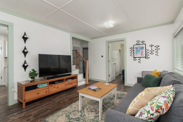 Unwind in your spacious living area with modern TV, cozy seating, and stylish decor creating the perfect atmosphere for relaxation.