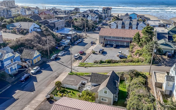 Coastal community with beach access, showing nearby residential area and ocean proximity for vacation rental location.