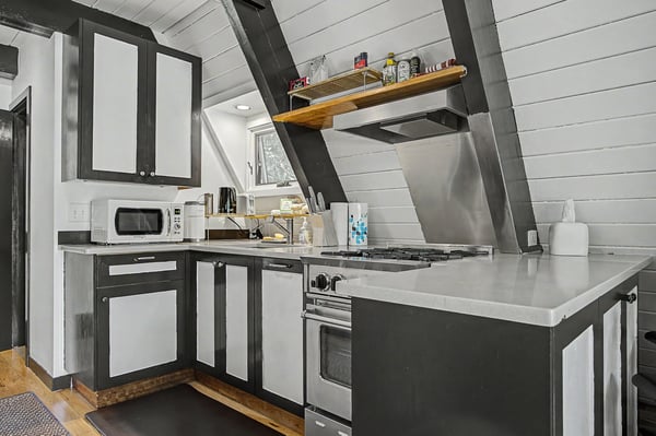 Whip up your favorite meals in this modern full kitchen, equipped with a stove, microwave, and all the essentials you need to feel right at home.