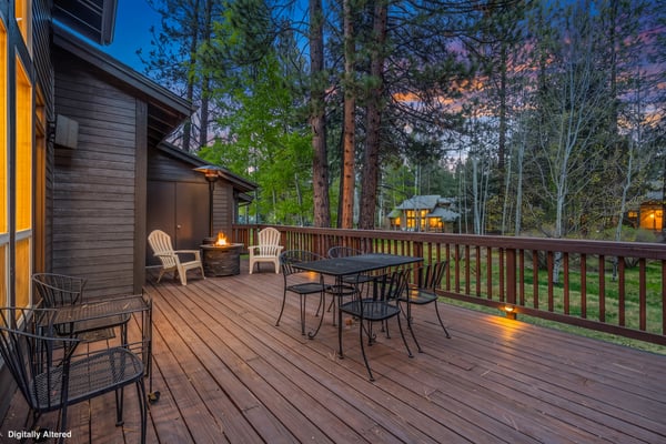 Picture yourself unwinding on this spacious deck, warmed by the crackling fire pit as twilight colors paint the sky above the pines. Your perfect evening retreat awaits.