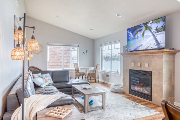 Curl up on your plush sectional by the crackling fireplace, beneath warm woven pendant lights and tropical scenes on the big screen.