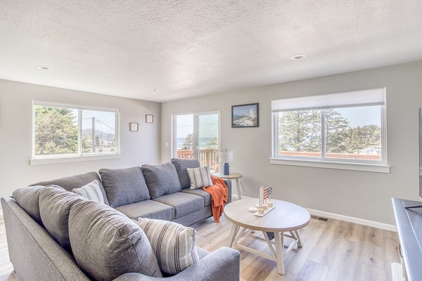 Sink into plush seating while framing views of iconic landmarks through expansive windows. Natural light floods your living space, creating a serene sanctuary for morning coffee or evening relaxation.