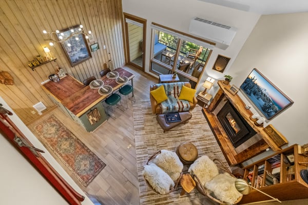 Step inside this beautifully designed open living space where rustic charm meets modern comfort. You'll love the soaring ceilings, cozy fireplace, and seamless indoor-outdoor flow to your private patio.