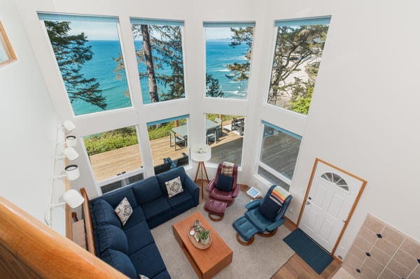 Your spacious living room features floor-to-ceiling windows framing breathtaking ocean views, creating the perfect retreat to unwind.