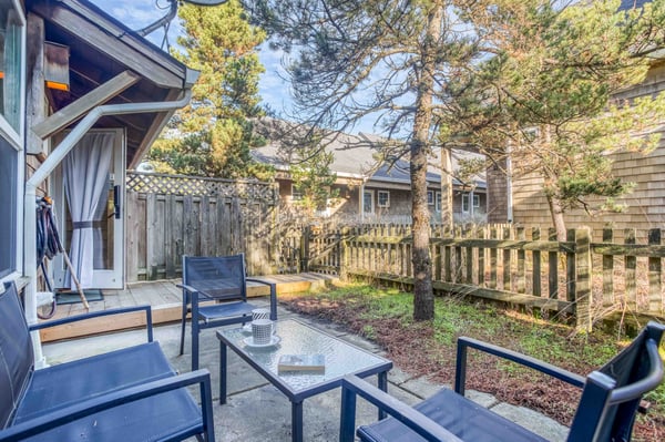 Relax on your private patio with comfortable seating and peaceful garden views, perfect for morning coffee or evening conversations.