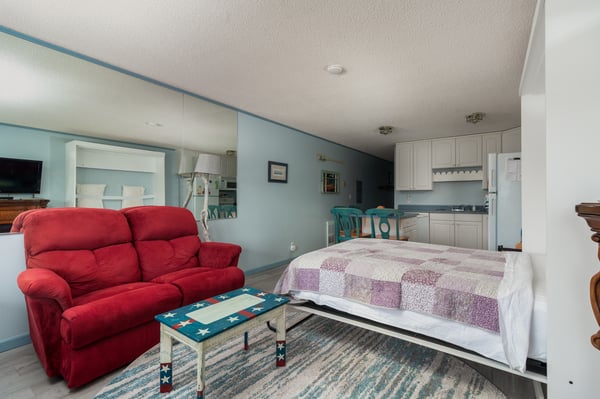 Sink into your cozy retreat with plush seating, a comfortable bed, and your own kitchenette—everything you need for an effortless, relaxing stay in one inviting space.