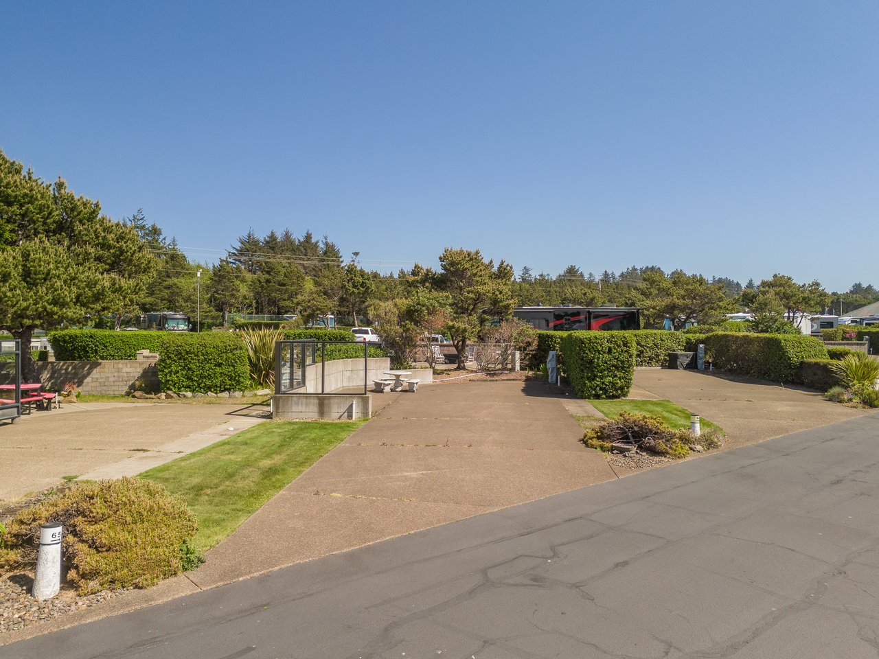 A peaceful vacation rental community featuring well-maintained landscaping, communal gathering areas, and scenic natural surroundings for a relaxing coastal getaway.