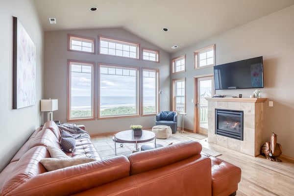 Relax in your bright living room with stunning panoramic views, cozy fireplace, and comfortable seating for unwinding after your adventures.