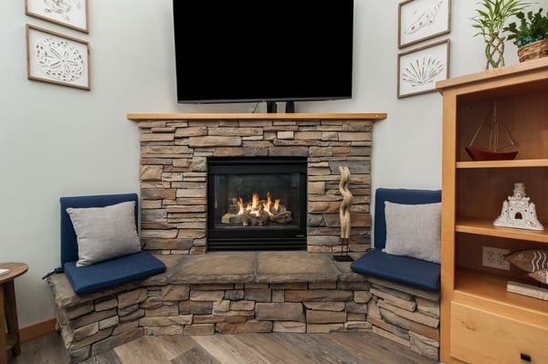 Curl up by your cozy stone fireplace with crackling flames, perfect for unwinding after mountain adventures.