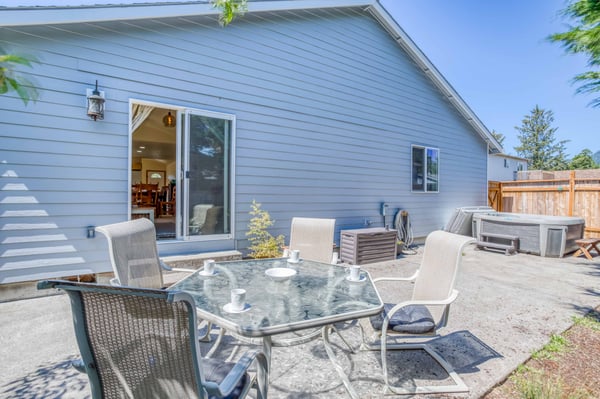 Back Patio space with seating and a table