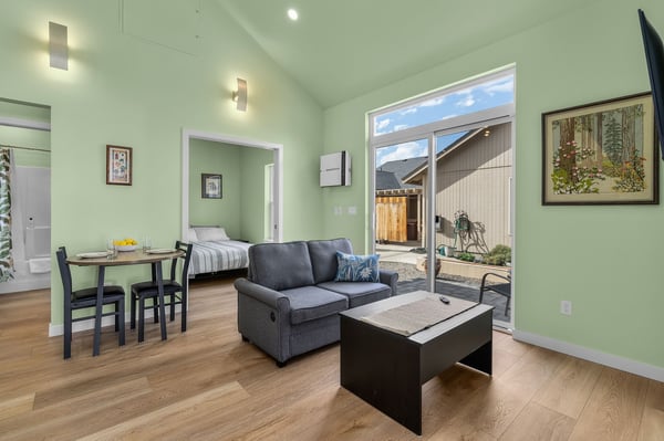 Sliding Glass Door opens to patio and shared fenced yard area