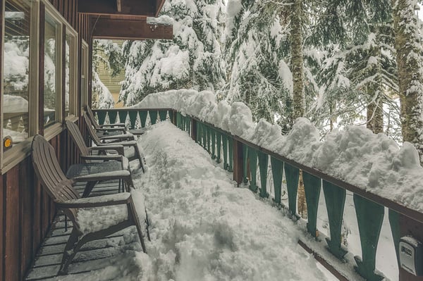 Moosewood Cabin snowy front porch