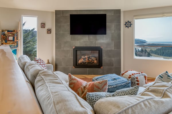 Newly Renovated fireplace with wall studded television