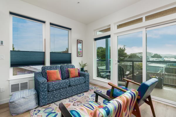 Relax in your bright living space with stylish furnishings and step onto your private balcony to enjoy views of the surrounding neighborhood.